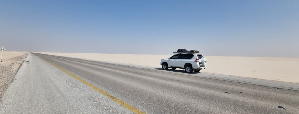 The Rub al Khali Road showing a large flat area devoid of anything other than sand