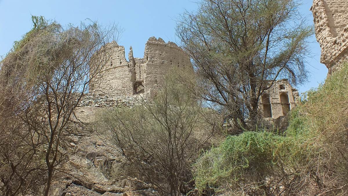 QA view looking up at the ruined towers at Rustaq, Oman