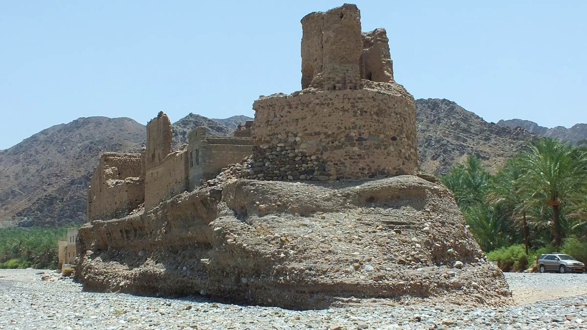 A series of structures atop an island at Wadi Bani Hinay, Oman
