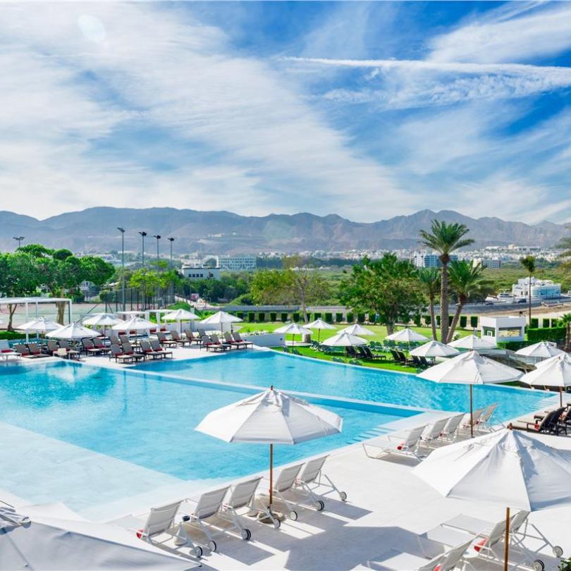 view of pool, muscat city and mountains